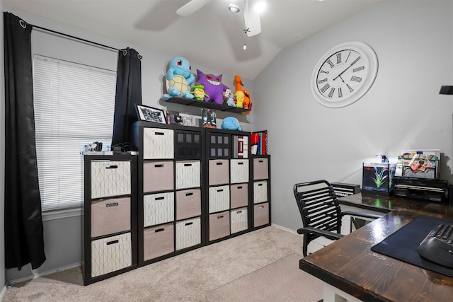 carpeted office space with lofted ceiling and ceiling fan