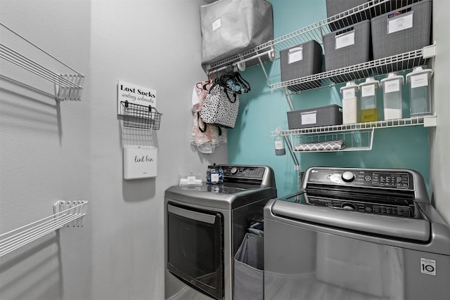 laundry room with washer and dryer