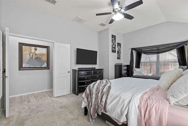 bedroom featuring ceiling fan, vaulted ceiling, and light hardwood / wood-style flooring