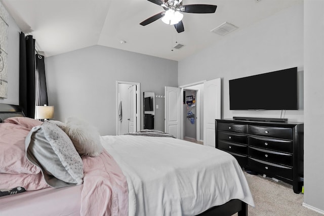 bedroom with light colored carpet, lofted ceiling, and ceiling fan