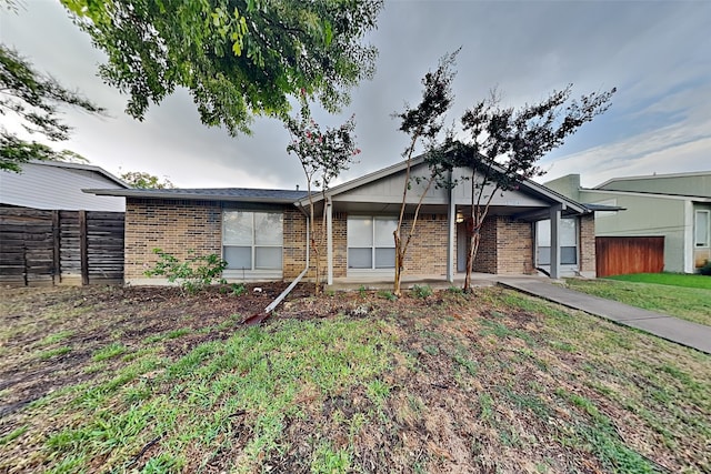 ranch-style house with a front yard