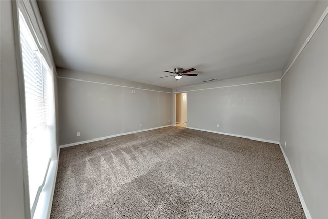 empty room with carpet flooring and ceiling fan