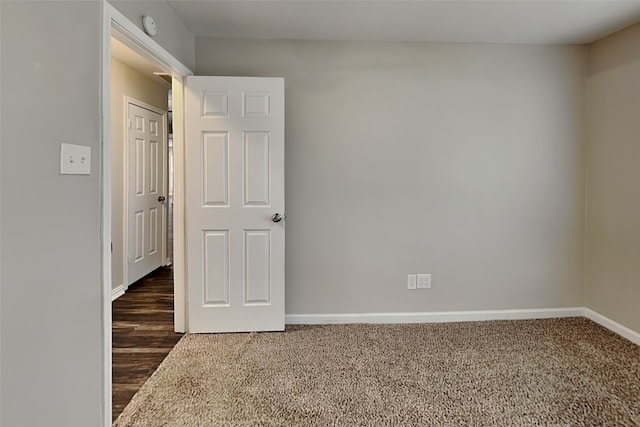 unfurnished bedroom featuring dark wood-type flooring