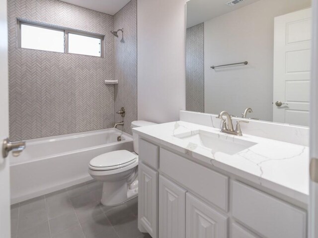 full bathroom with tile patterned flooring, vanity, toilet, and tiled shower / bath