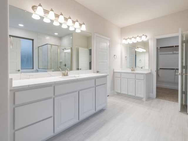 bathroom with vanity and an enclosed shower