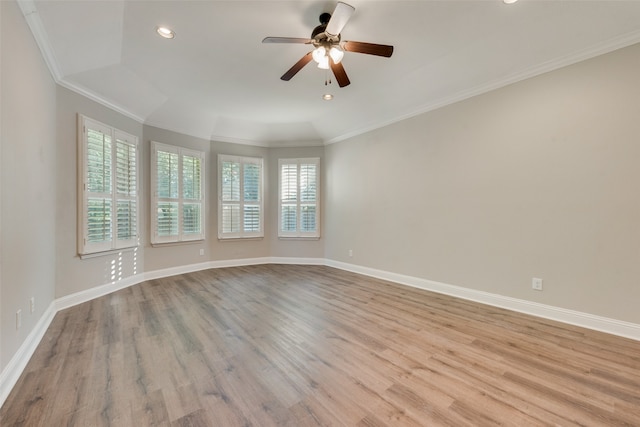 empty room with crown molding, ceiling fan, and light wood-type flooring