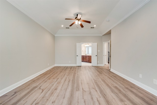 spare room with light wood-type flooring, ornamental molding, and ceiling fan