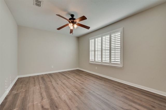 empty room featuring ceiling fan and light wood-type flooring