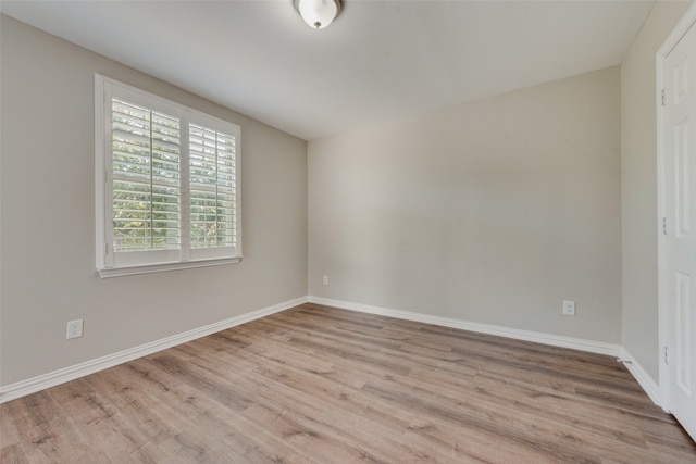 unfurnished room featuring light wood-type flooring