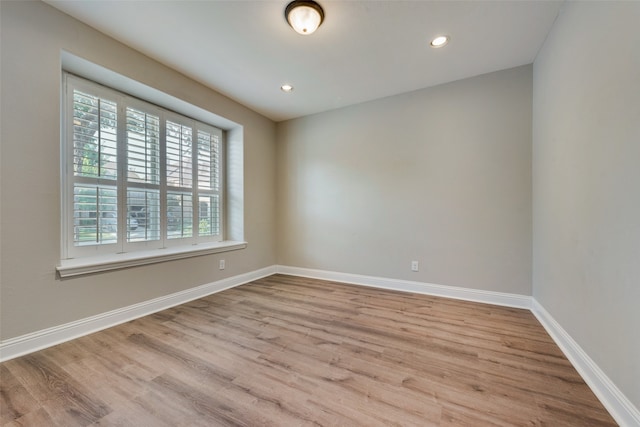 spare room featuring light wood-type flooring