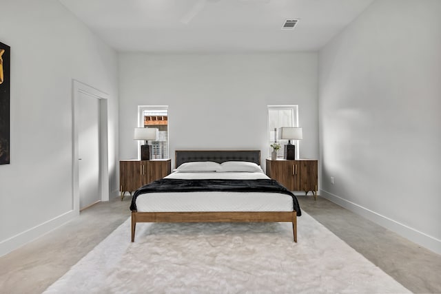 bedroom featuring ceiling fan and light carpet