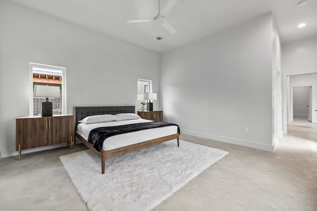 bedroom with a high ceiling and ceiling fan