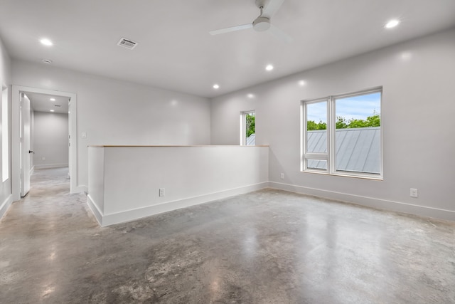 unfurnished room with concrete flooring and ceiling fan