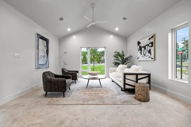 living room featuring ceiling fan, plenty of natural light, and vaulted ceiling