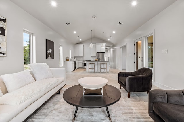 living room featuring lofted ceiling