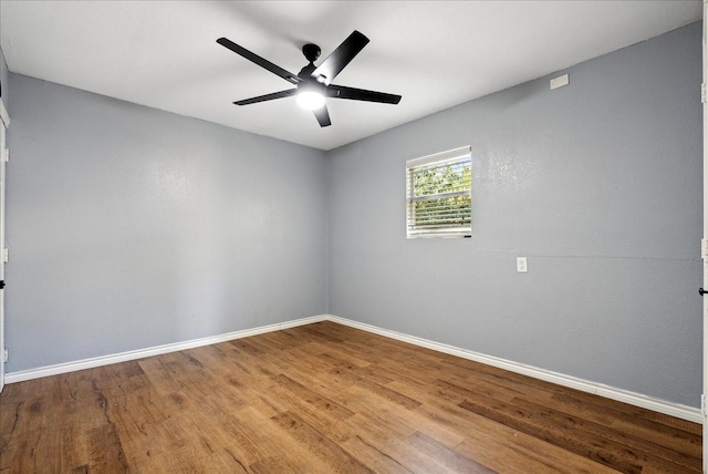 unfurnished room with ceiling fan and hardwood / wood-style floors