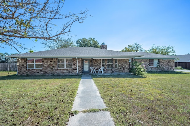 single story home with a front yard