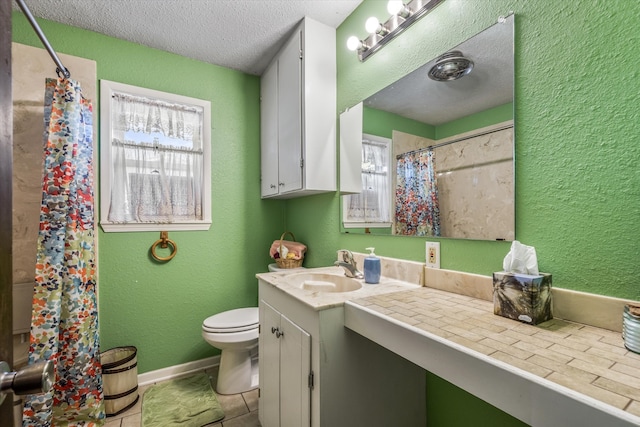 bathroom with toilet, tile patterned flooring, vanity, a textured ceiling, and a shower with shower curtain