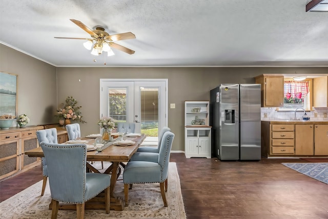 dining room featuring ceiling fan, dark hardwood / wood-style floors, sink, and french doors