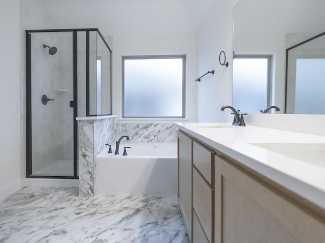 bathroom with vanity and separate shower and tub