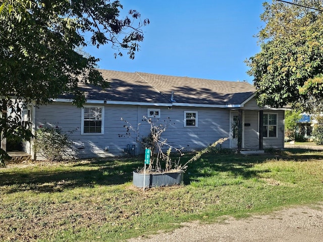 back of house with a yard