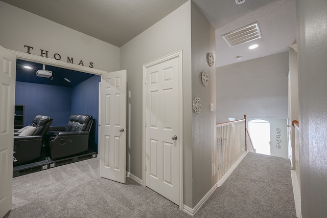 corridor with carpet floors