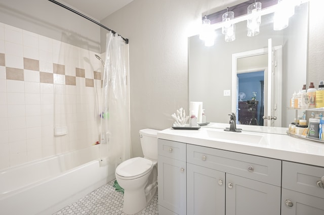 full bathroom featuring tile patterned flooring, vanity, toilet, and shower / tub combo with curtain