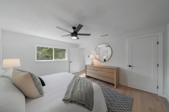 bedroom featuring ceiling fan and light hardwood / wood-style floors