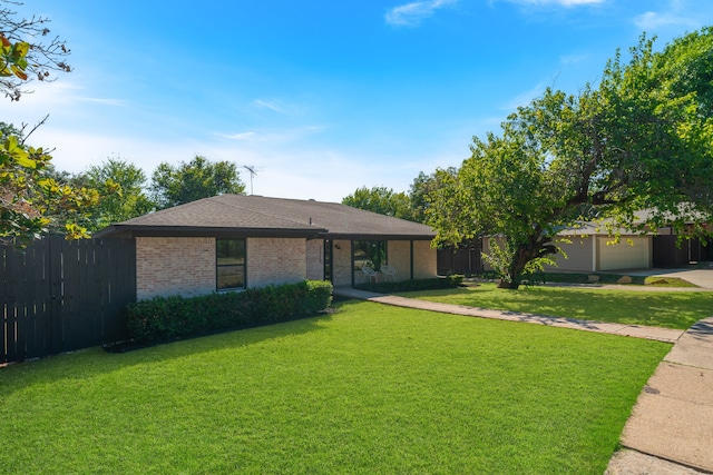 ranch-style home with a front yard