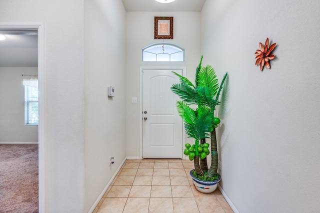 tiled entryway with a healthy amount of sunlight