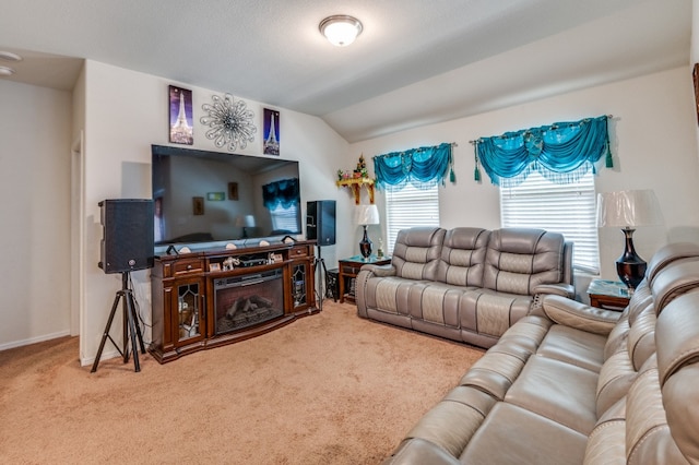 living room with lofted ceiling and carpet floors