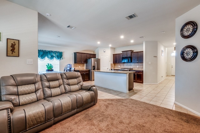 living room with sink and light tile patterned floors