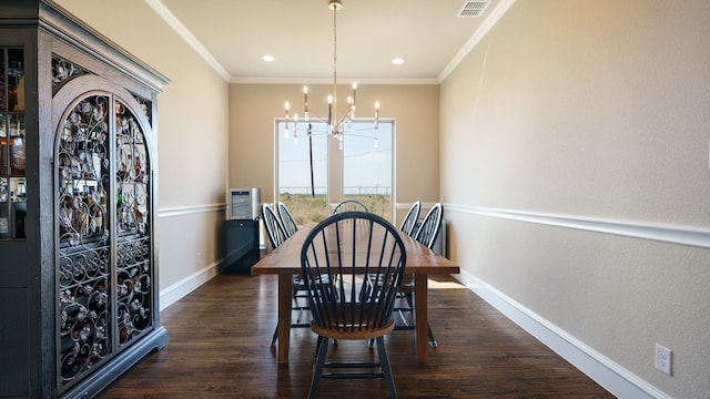 dining space with ornamental molding, dark hardwood / wood-style flooring, and a chandelier