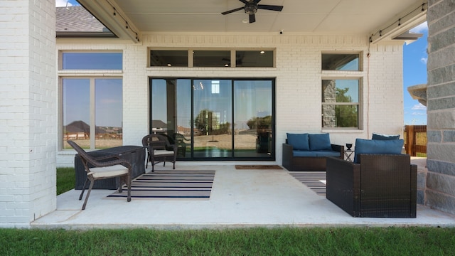 view of patio with ceiling fan and an outdoor hangout area