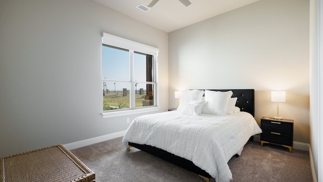 bedroom featuring dark colored carpet and ceiling fan