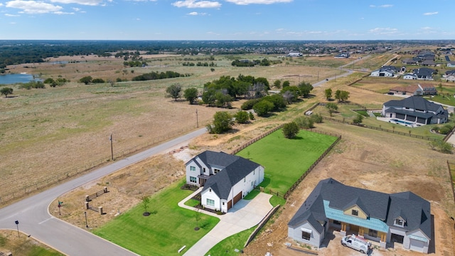 birds eye view of property with a rural view