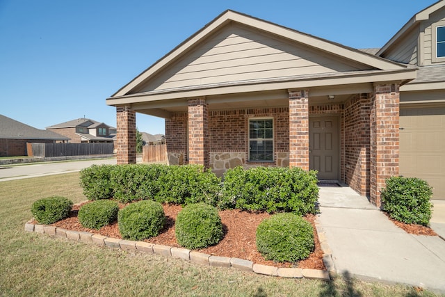 view of front of home featuring a front lawn and a garage