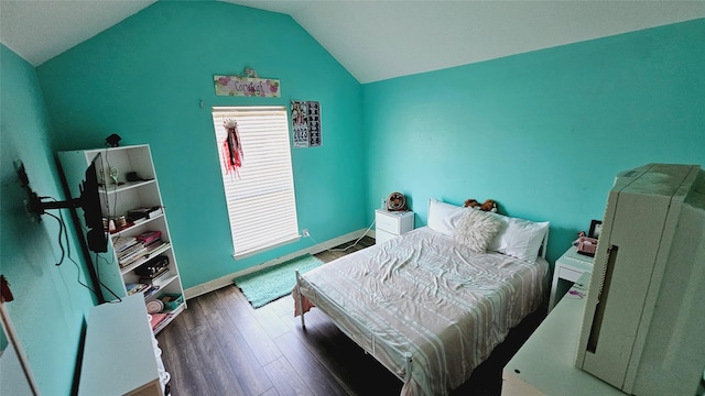 bedroom with lofted ceiling and dark hardwood / wood-style floors