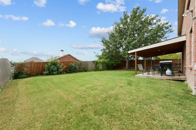 view of yard featuring a wooden deck