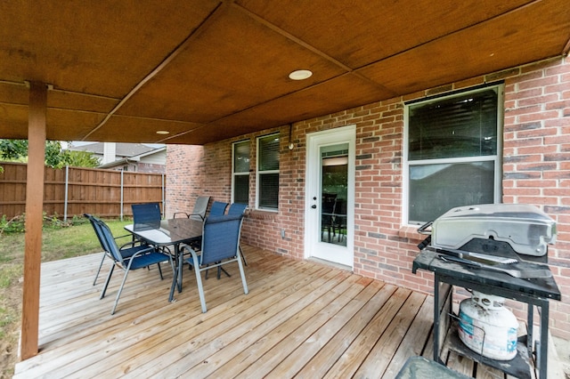 wooden terrace with area for grilling