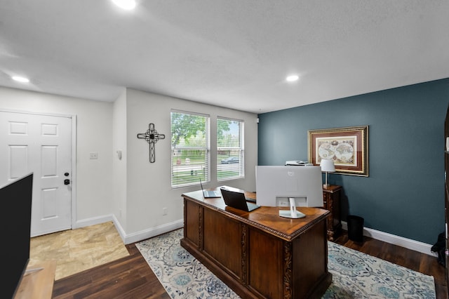 home office with wood-type flooring