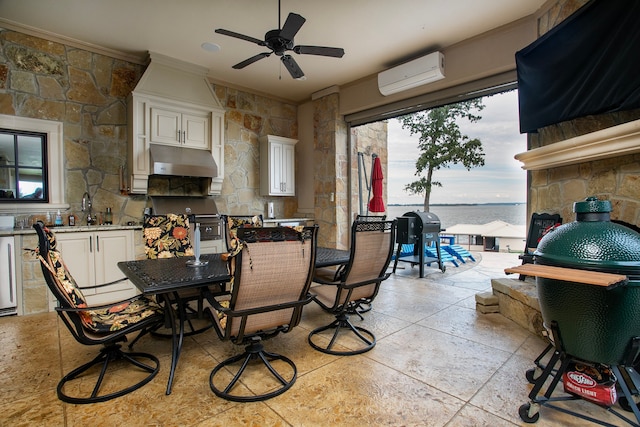 dining space with ceiling fan, ornamental molding, and a wall mounted air conditioner