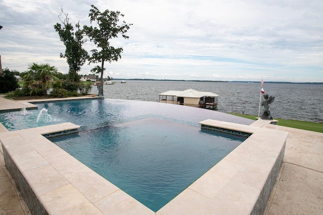 view of pool with a water view and pool water feature