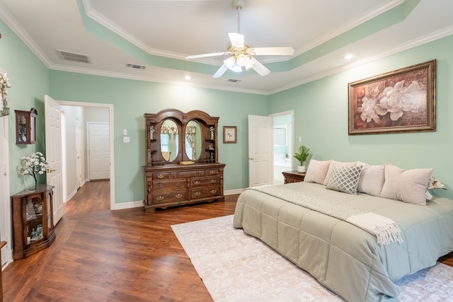 bedroom featuring a raised ceiling, ceiling fan, dark hardwood / wood-style flooring, and ornamental molding