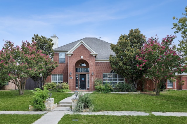 front facade with a front lawn