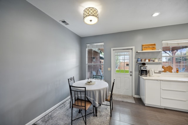 dining space featuring dark hardwood / wood-style flooring