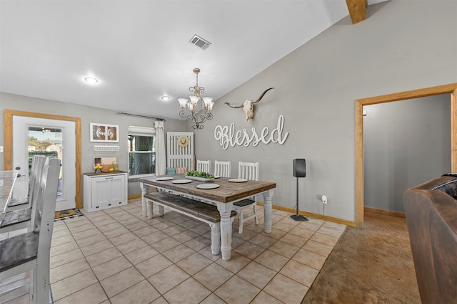 tiled dining space featuring a chandelier and lofted ceiling with beams