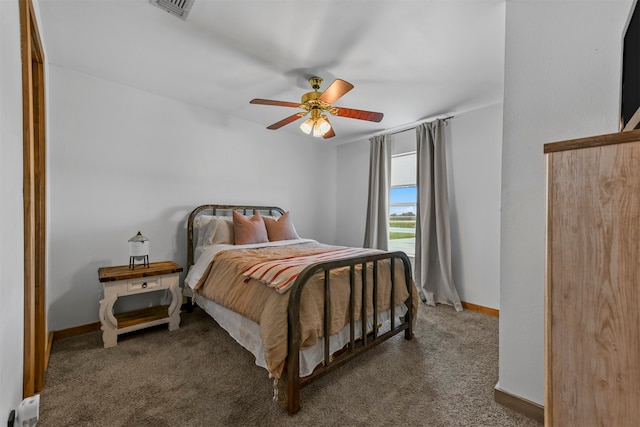 bedroom featuring ceiling fan and carpet