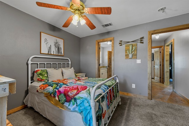 carpeted bedroom featuring connected bathroom and ceiling fan