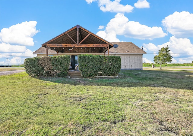 exterior space with a gazebo and a yard